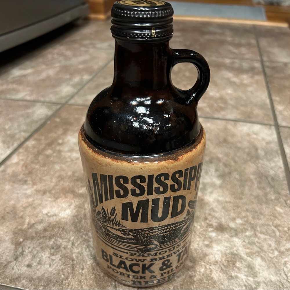 Right handed empty Mississippi Mud bottle
